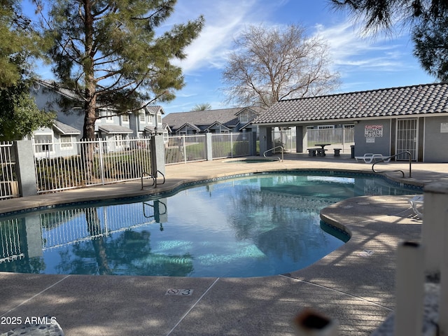 view of swimming pool with a patio area