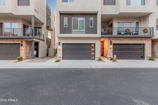 townhome / multi-family property with a garage