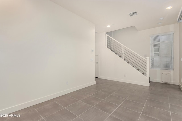 spare room featuring tile patterned flooring