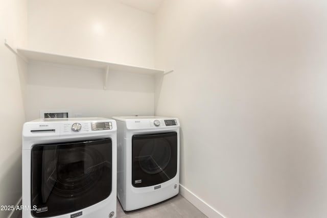 washroom with independent washer and dryer