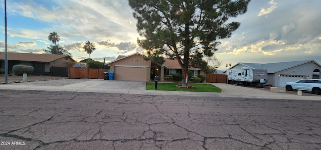 ranch-style home with a lawn