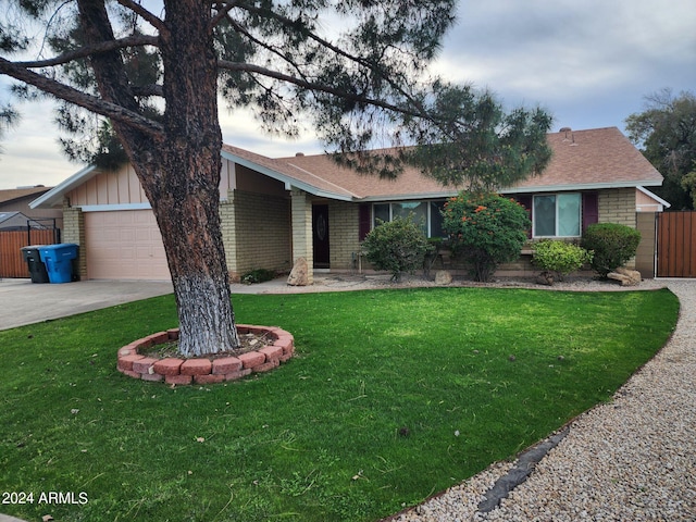 single story home with a front lawn and a garage