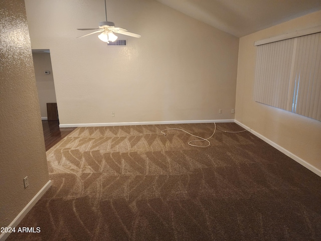 carpeted empty room with vaulted ceiling and ceiling fan