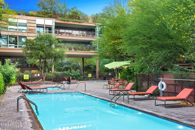 view of pool featuring a patio area