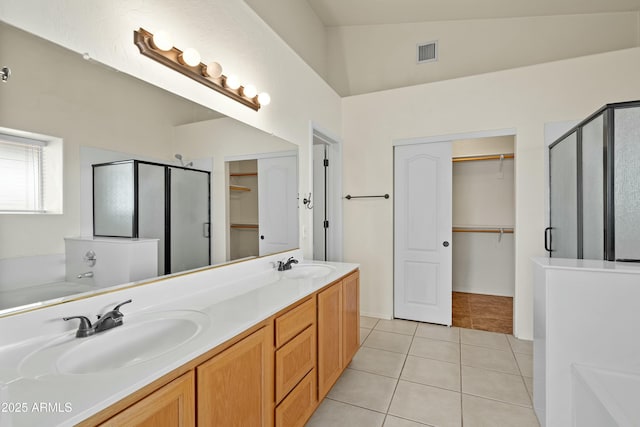 full bath featuring tile patterned flooring, a sink, visible vents, a shower stall, and a bath