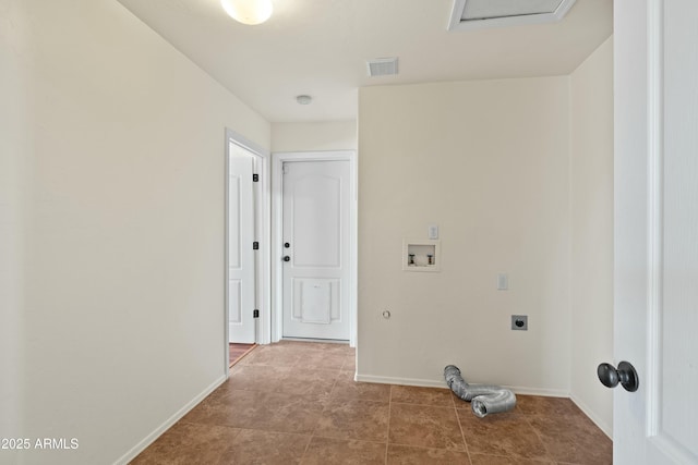 clothes washing area featuring visible vents, washer hookup, electric dryer hookup, and baseboards