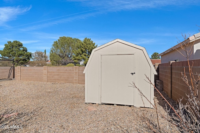 view of shed with a fenced backyard