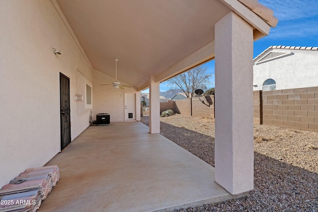 view of patio with a fenced backyard and a ceiling fan