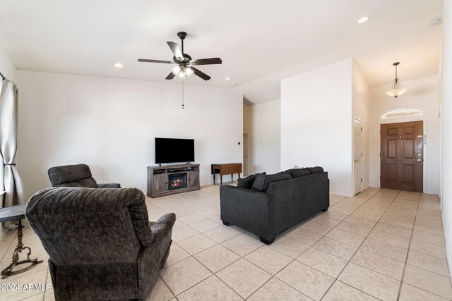 living room with light tile patterned floors and ceiling fan