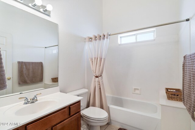 full bathroom featuring vanity, toilet, and shower / bathtub combination with curtain