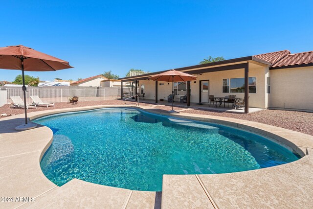 view of swimming pool with a patio area