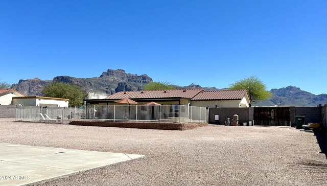 rear view of house featuring a mountain view