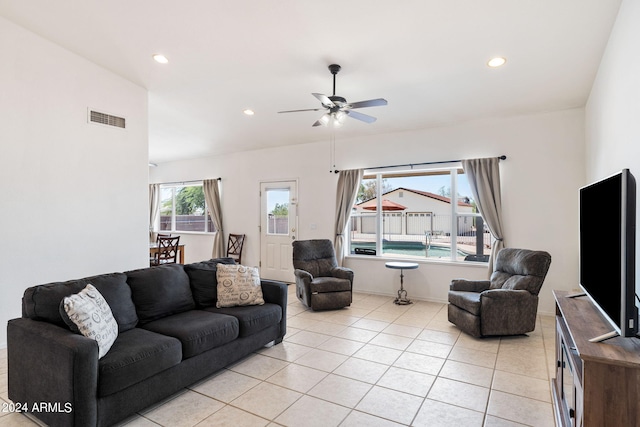 tiled living room featuring ceiling fan