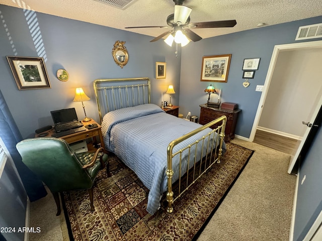 bedroom featuring baseboards, visible vents, a ceiling fan, dark colored carpet, and a textured ceiling