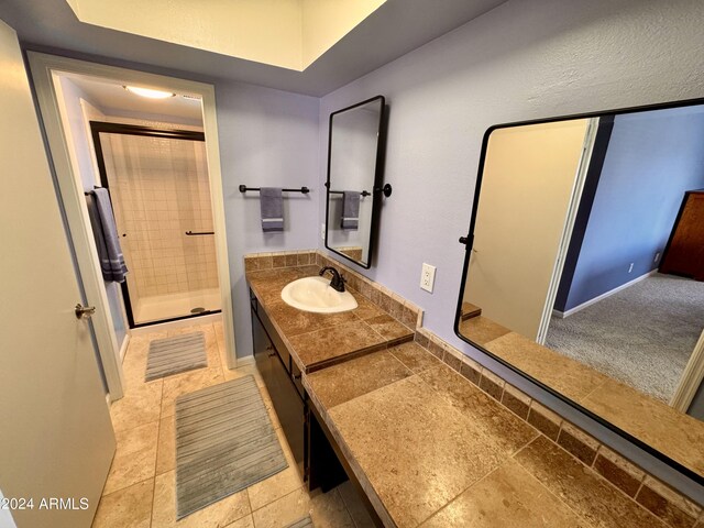 bathroom with vanity, toilet, and tile patterned flooring