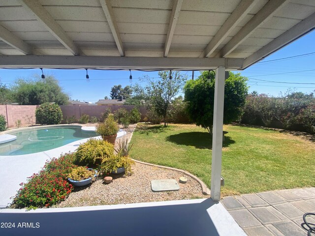 view of yard with a fenced in pool and a fenced backyard