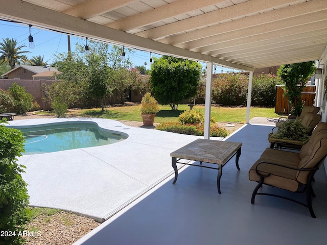 view of swimming pool featuring a fenced in pool, a patio area, a lawn, and a fenced backyard