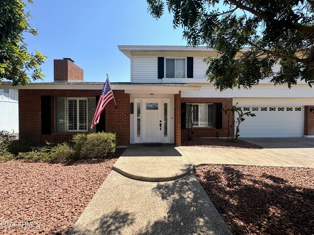 view of front of home with a garage