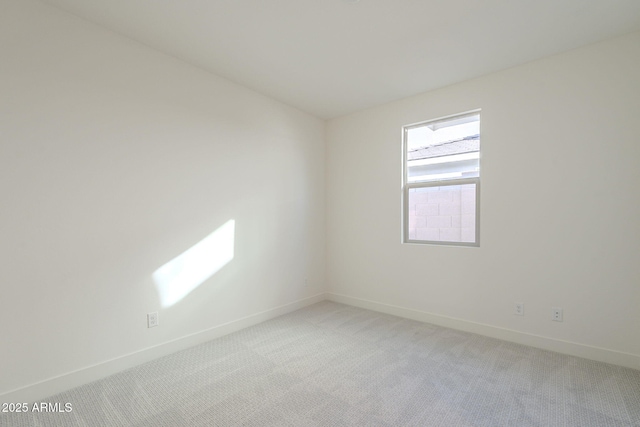 empty room with light colored carpet