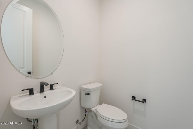 bathroom featuring sink and toilet