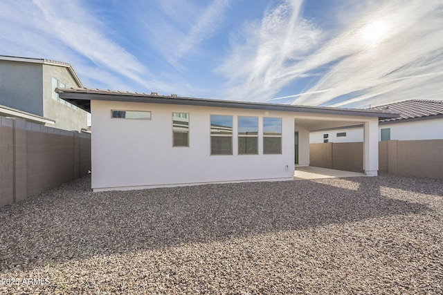 back of house with a patio area