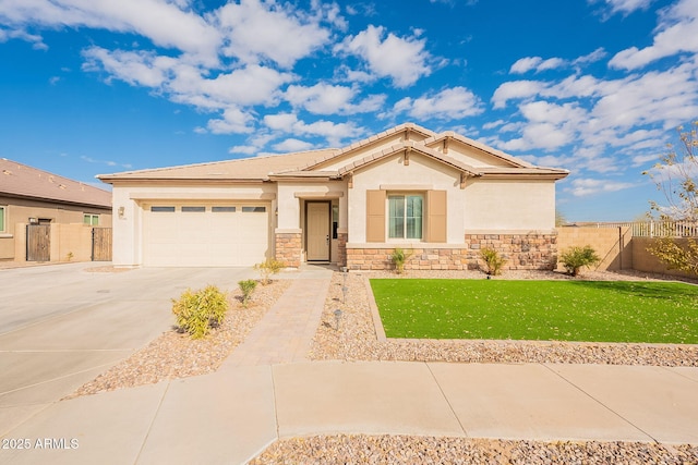 view of front of house featuring a garage and a front lawn