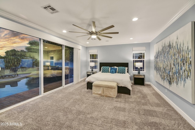 carpeted bedroom with ornamental molding and ceiling fan