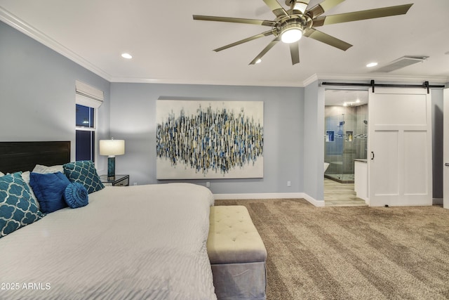 bedroom with carpet, ensuite bath, a barn door, and ornamental molding