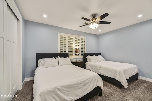 bedroom with ceiling fan and dark colored carpet