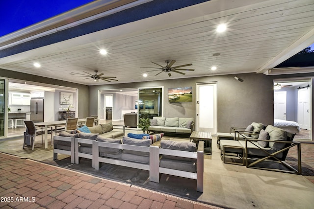 view of patio / terrace featuring ceiling fan and outdoor lounge area