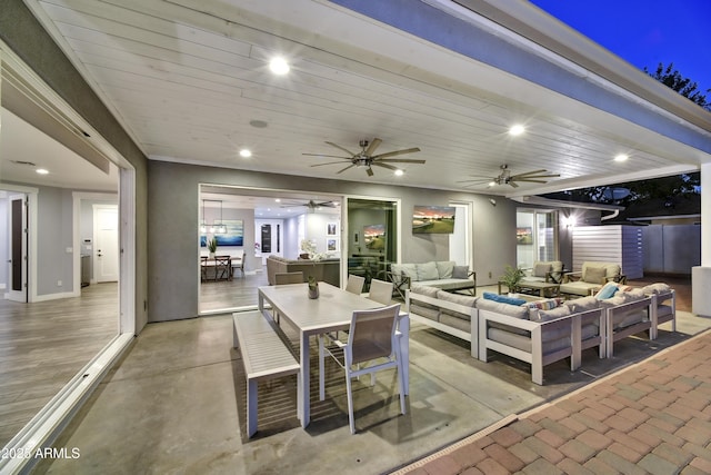 view of patio with ceiling fan and an outdoor hangout area