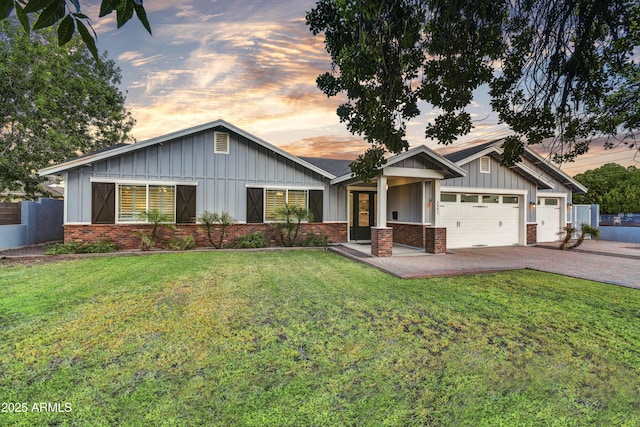 craftsman house featuring a garage and a yard