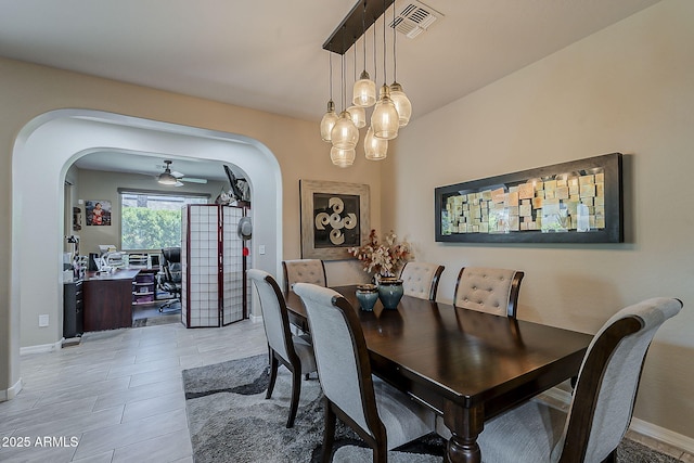 12738 W Brookhart Way, Peoria, AZ 85383 - dining area featuring arched walkways, baseboards, and an office area