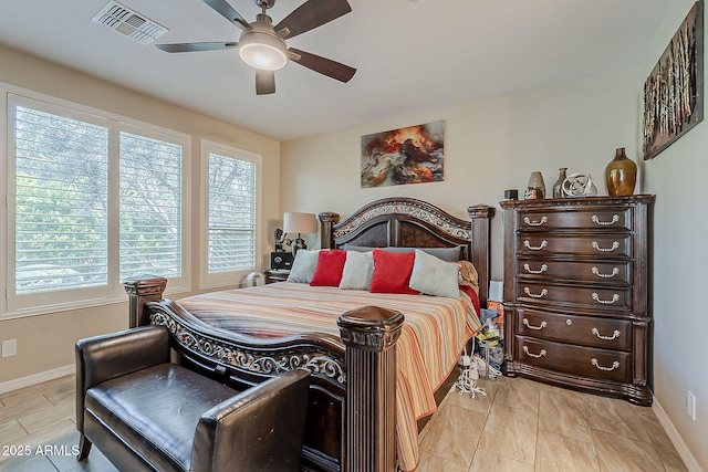 12738 W Brookhart Way, Peoria, AZ 85383 - bedroom with multiple windows, baseboards, and ceiling fan