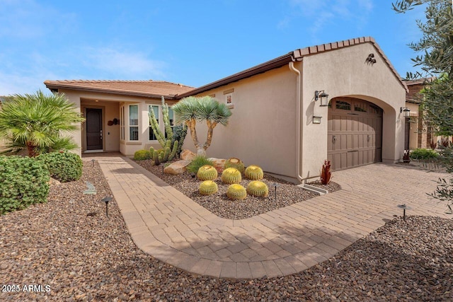 12738 W Brookhart Way, Peoria, AZ 85383 - mediterranean / spanish-style home with stucco siding, an attached garage, decorative driveway, and a tile roof