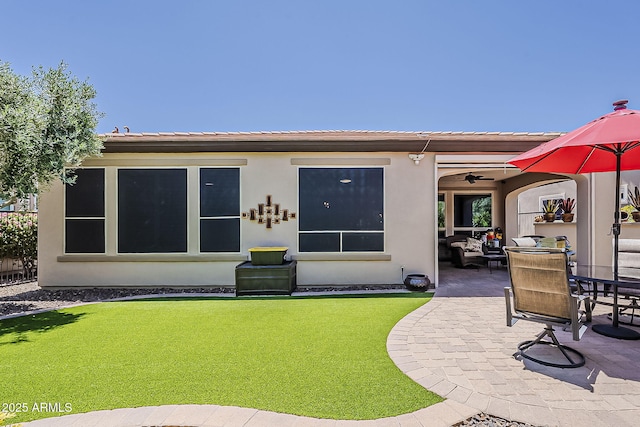 12738 W Brookhart Way, Peoria, AZ 85383 - rear view of house with a patio, stucco siding, and a yard