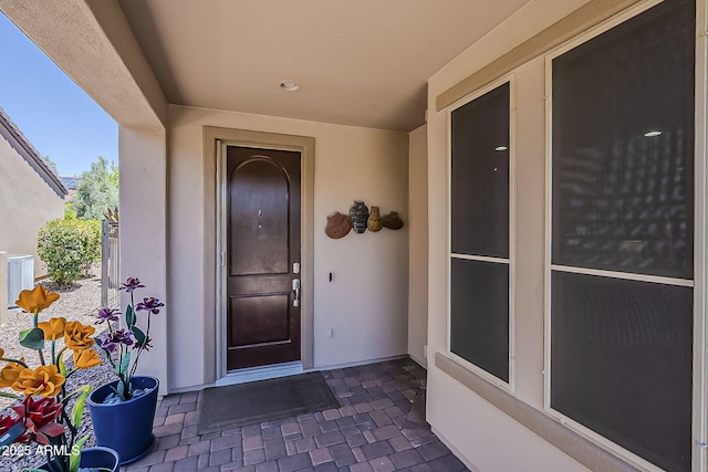 12738 W Brookhart Way, Peoria, AZ 85383 - doorway to property featuring stucco siding and central AC