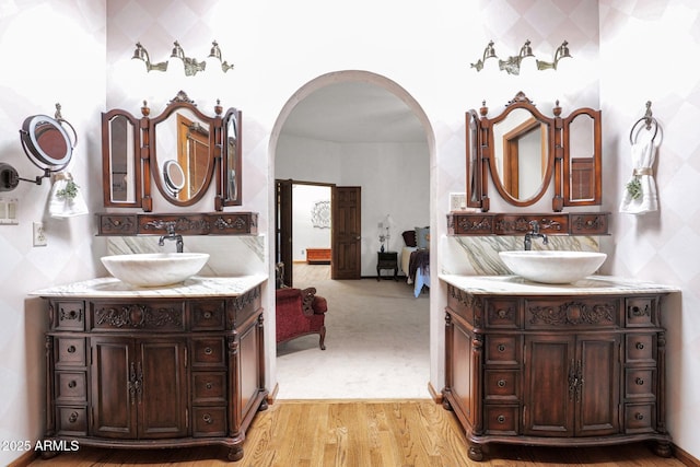 1338 W Mountain View Dr, Mesa, AZ 85201 - ensuite bathroom featuring two vanities and wood finished floors