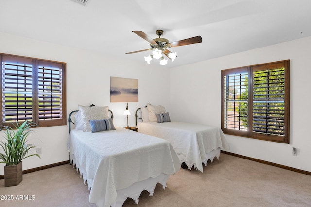 1338 W Mountain View Dr, Mesa, AZ 85201 - carpeted bedroom featuring baseboards and ceiling fan