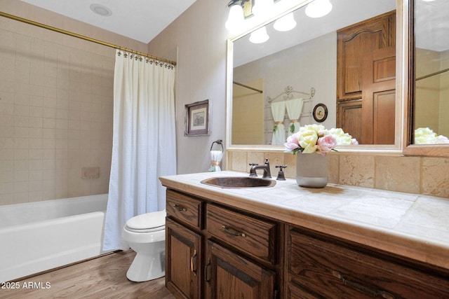 1338 W Mountain View Dr, Mesa, AZ 85201 - full bathroom featuring toilet, vanity, wood finished floors, and shower / bathtub combination with curtain