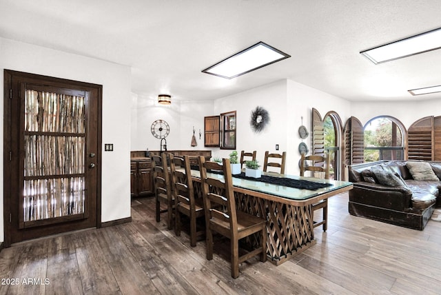1338 W Mountain View Dr, Mesa, AZ 85201 - dining area with dark wood-type flooring and baseboards