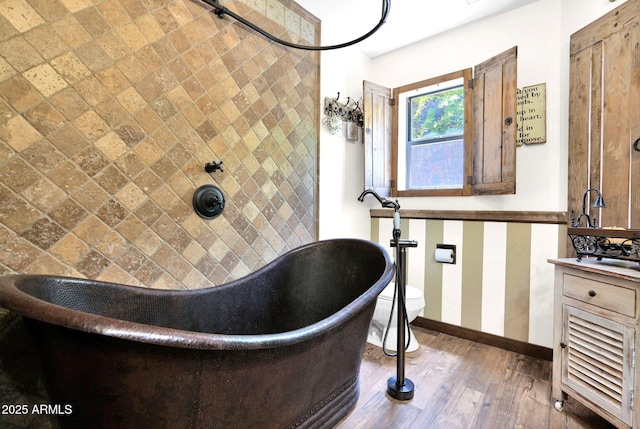 1338 W Mountain View Dr, Mesa, AZ 85201 - full bathroom with a soaking tub, baseboards, hardwood / wood-style flooring, and vanity