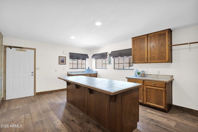 1338 W Mountain View Dr, Mesa, AZ 85201 - kitchen with tile counters, dark wood finished floors, baseboards, a breakfast bar, and recessed lighting