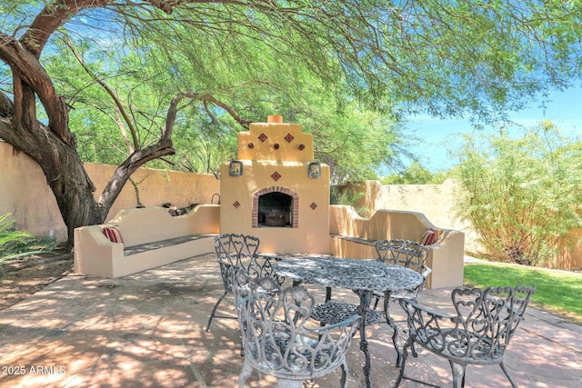 1338 W Mountain View Dr, Mesa, AZ 85201 - view of patio / terrace with exterior fireplace and outdoor dining space