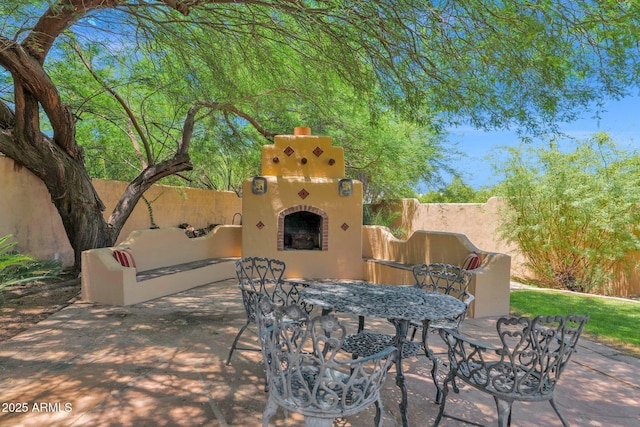 1338 W Mountain View Dr, Mesa, AZ 85201 - view of patio / terrace with an outdoor fireplace and outdoor dining space