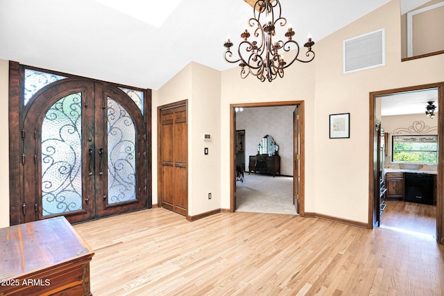 1338 W Mountain View Dr, Mesa, AZ 85201 - foyer featuring plenty of natural light, light wood-style flooring, a chandelier, french doors, and high vaulted ceiling
