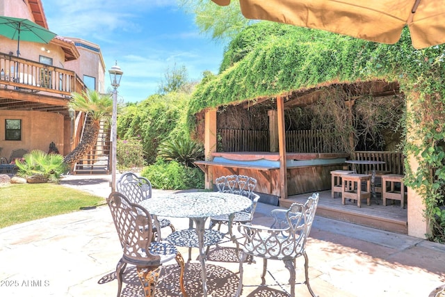 1338 W Mountain View Dr, Mesa, AZ 85201 - view of patio / terrace featuring a hot tub, outdoor dining area, stairs, and a wooden deck