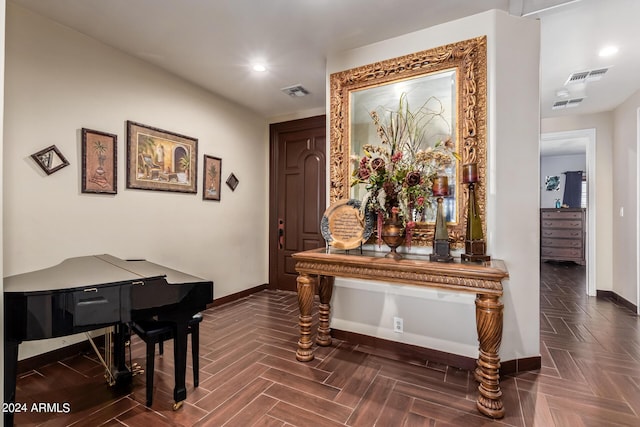 hall with dark parquet flooring