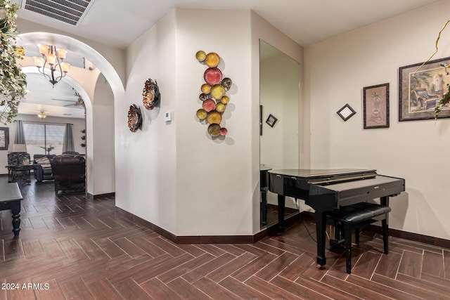 hallway with dark parquet flooring