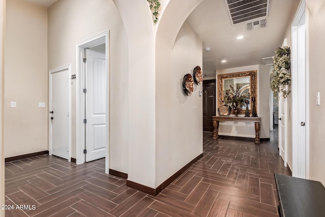 hallway with dark parquet flooring